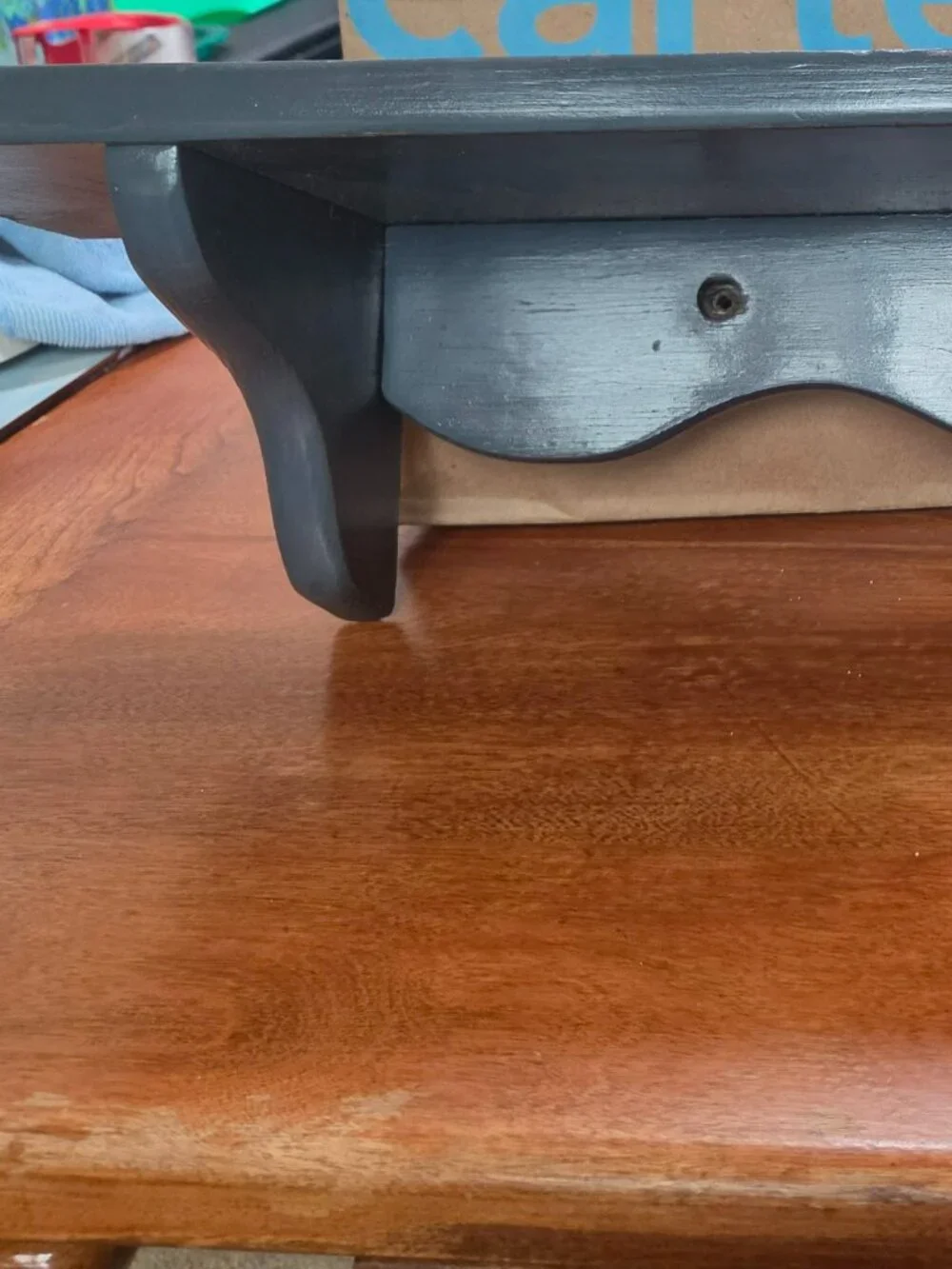 WOODEN BLUE SHELF 24 INCHES LONG TOP SHELF IS 6 INCHES  WIDE
